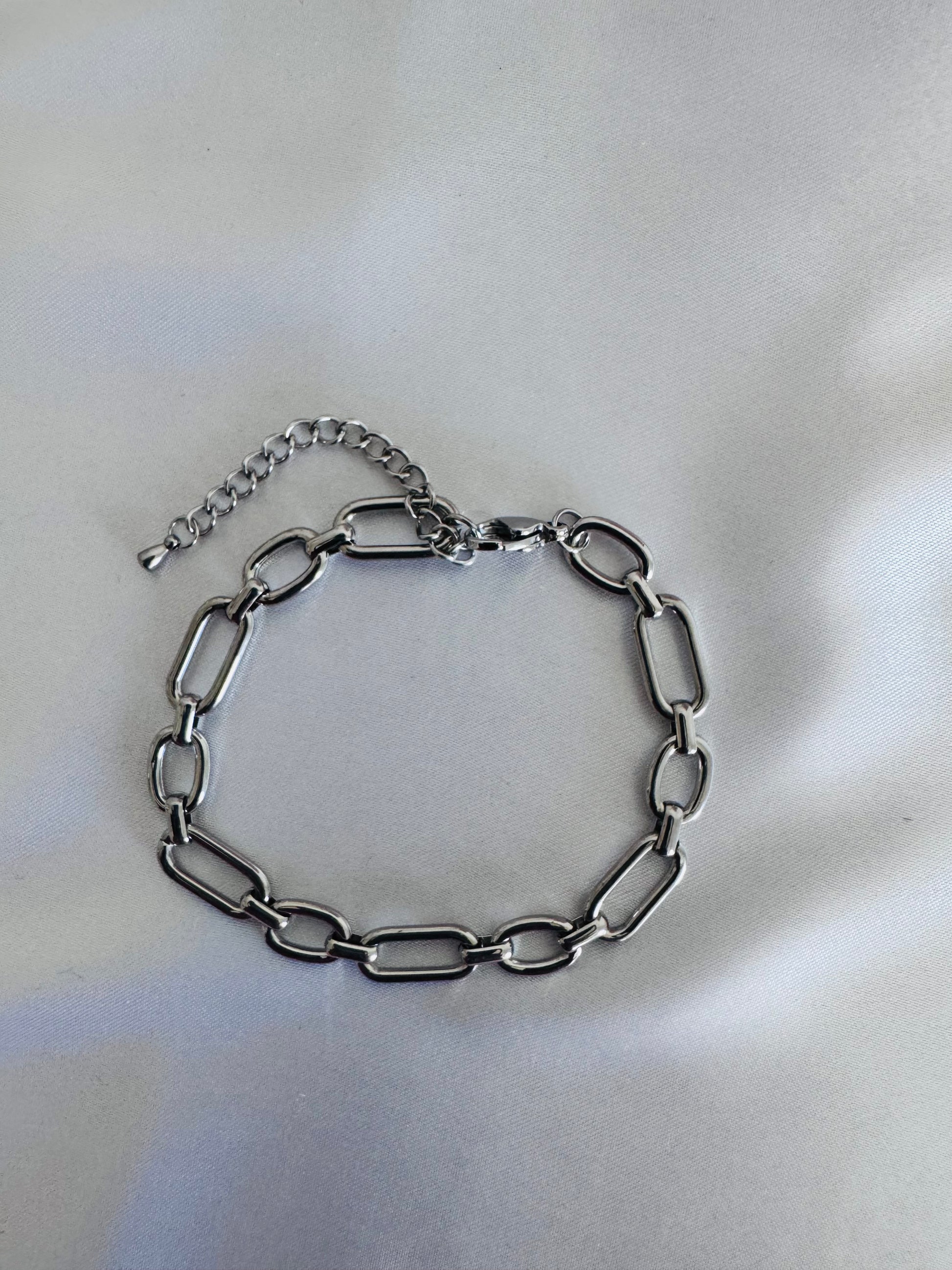 Silver chain anklet  on a light background