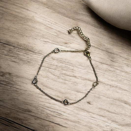Chain anklet on a wooden surface